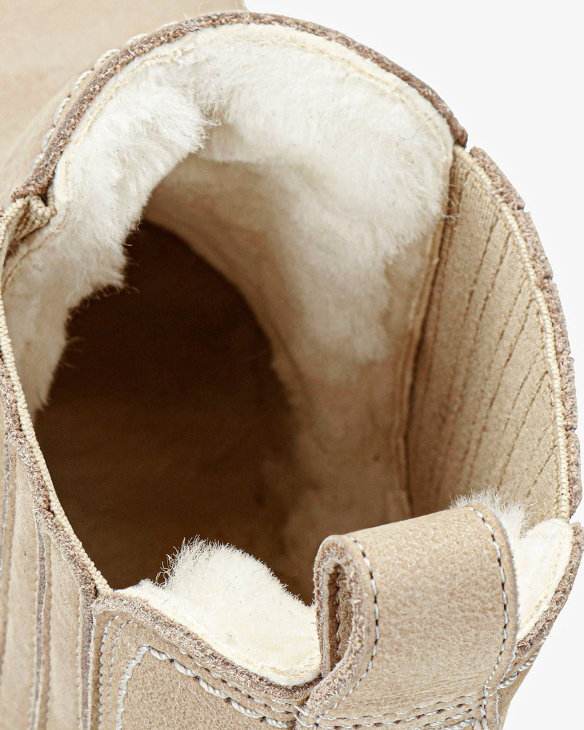 Brigitte Igloo Trav botín de piel con forro interior de pelo natural. crudo