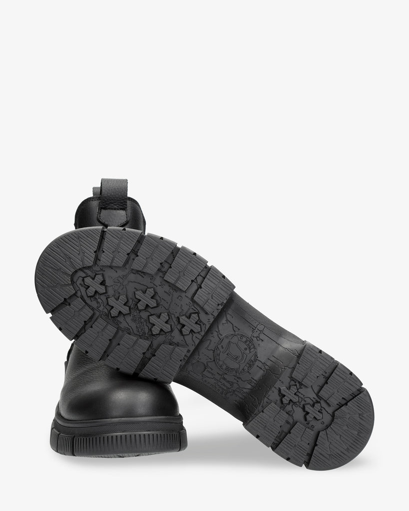 Nery Igloo botines de piel con forro interior de pelo natural. negro